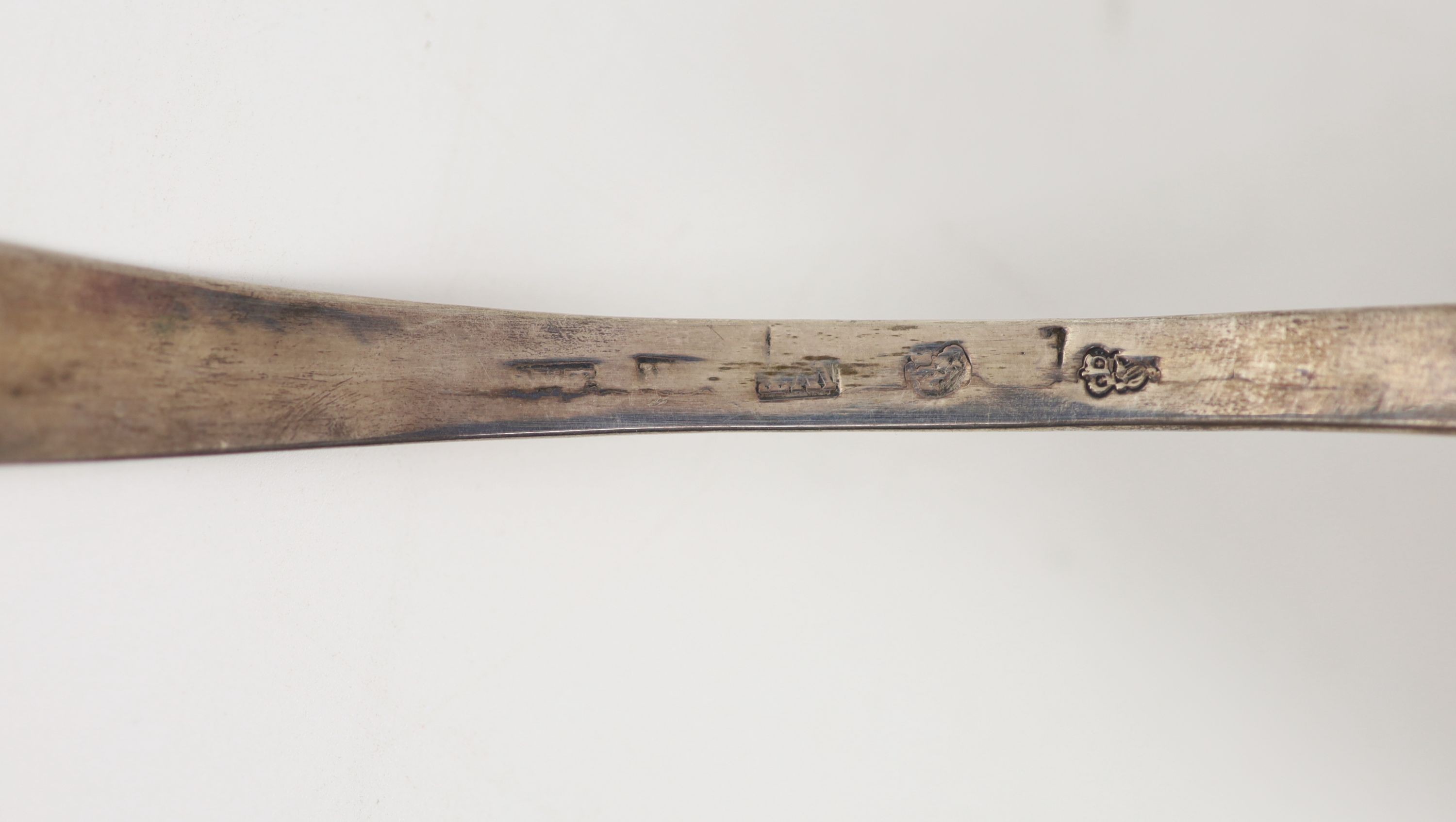 An 18th century Irish pierced silver fish serving ladle, maker W.T., marks rubbed, 30.2cm, 99 grams.